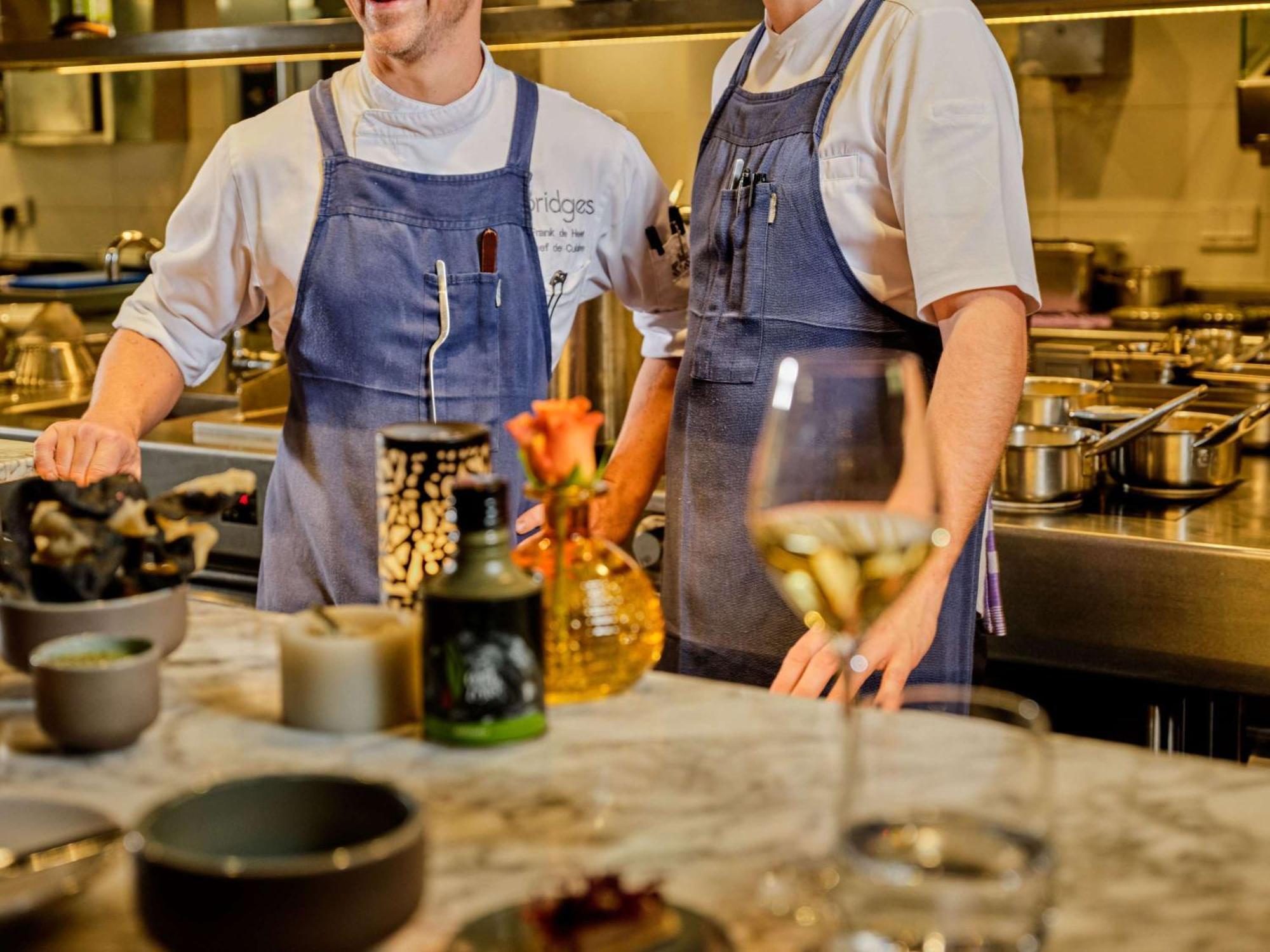 Hotel Sofitel Legend The Grand Amsterdam Esterno foto Two chefs in a restaurant kitchen